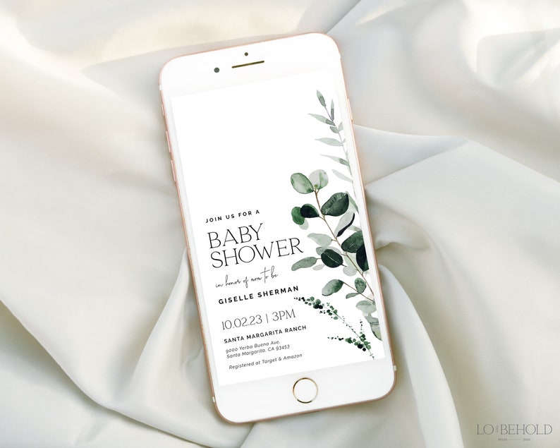 May include: A smartphone screen displaying a baby shower invitation with a green watercolor floral design. The invitation reads "Join us for a Baby Shower in honor of Giselle Sherman 10.02.23 | 3PM Santa Margarita Ranch Santa Margarita, CA 93453 Registered at Target & Amazon".