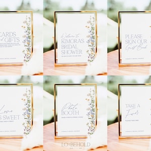 May include: Six printable signs with floral designs and text in a light purple font. The signs read: "Cards and Gifts", "Welcome to Kimora's Bridal Shower", "Please Sign Our Guest Book", "Love is Sweet", "Photo Booth", and "Take a Favor".