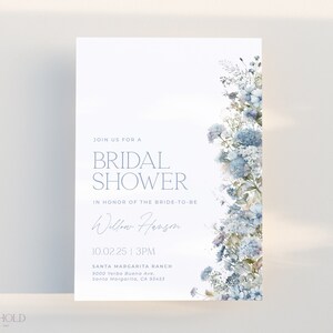 May include: A blue and white floral bridal shower invitation with the text "Join us for a Bridal Shower in honor of the bride-to-be Willow Herson 10.02.25 | 3PM Santa Margarita Ranch 9000 Yerba Buena Ave, Santa Margarita, CA 93453"