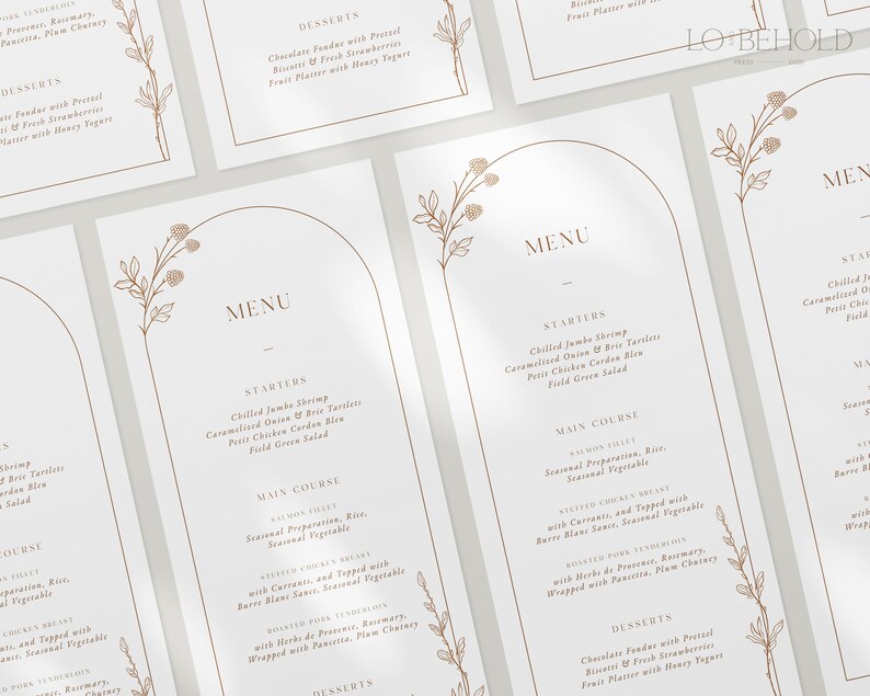May include: A white menu card with a brown floral design and a gold arch. The menu includes starters, main course, and desserts. The menu items are listed in a simple, elegant font.