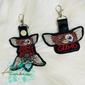  GRAPHICS & MORE Gremlins Gizmo Logo Keychain Rectangle Chrome  Plated Metal Bottle Cap Opener : Clothing, Shoes & Jewelry