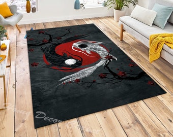 May include: A black and white yin yang rug with two koi fish swimming around a red circle. The rug has a grey background with black branches and red flowers.