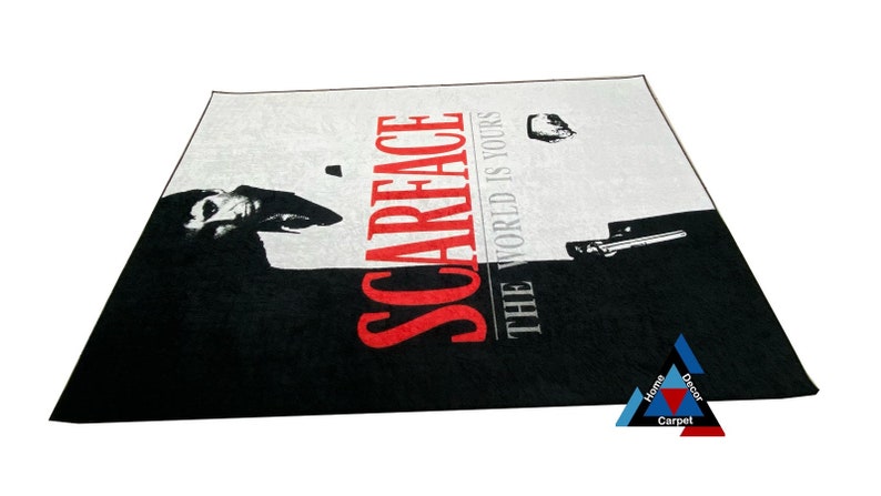 May include: Black and white rug with a red "Scarface" logo and the text "The World Is Yours".