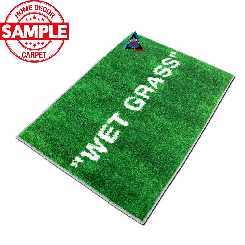 May include: A green doormat with white text that reads "WET GRASS".