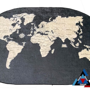 May include: A black oval rug with a beige world map design. The rug features the names of countries and continents. The rug has a "Home Decor Carpet" logo in the bottom right corner.