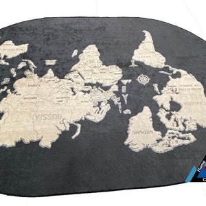 May include: A black and beige oval rug with a detailed map of the world printed on it. The rug is made of a soft, plush material and has a subtle sheen.