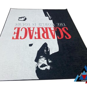 May include: A black and white rug with a red and white "Scarface" logo and the text "The World Is Yours".