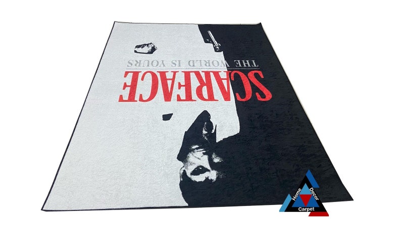 May include: A black and white rug with a red and white "Scarface" logo and the text "The World Is Yours".