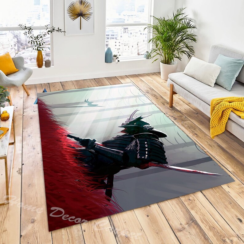 May include: A gray and red area rug with a black and white illustration of a samurai warrior. The warrior is wearing a helmet and armor and is holding a sword. The background is a light gray with white lines.