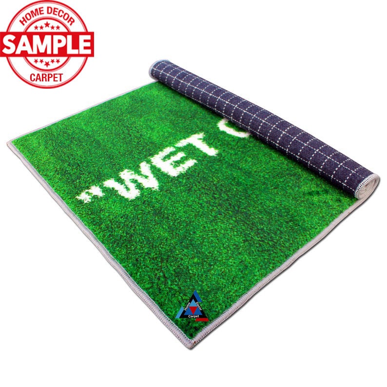 May include: A green and white doormat with the text "WET FLOOR" printed in white. The doormat is rolled up and has a black and white checkered pattern on the back.
