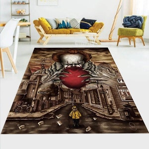May include: A brown and gray area rug with a graphic of a clown holding a red balloon. The clown is wearing a white collar and a black bow tie. The background is a city street with buildings and a street sign that reads "Derry Ave".