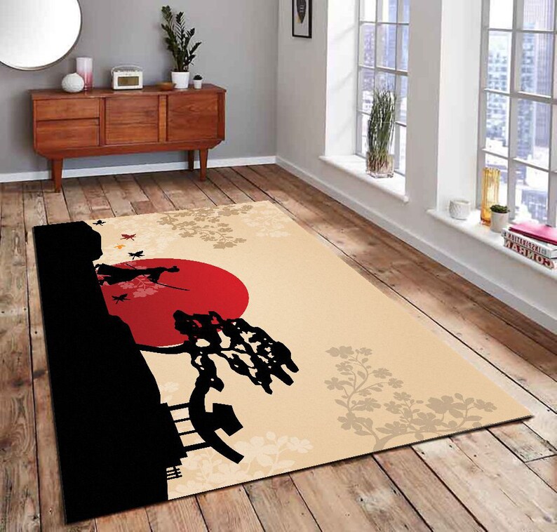 May include: A beige area rug with a black silhouette of a tree, a red sun, and two figures. The rug has a floral pattern in beige and brown.