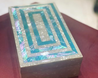 jewelry box , inalyed with white sheets of mother of pearl and colored sheets of natural abalone shells . handmade in EGYPT.