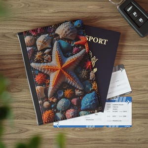 May include: Passport cover with a colorful seashell and starfish design. The cover is made of a durable material and features a zipper closure.