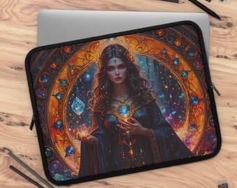 May include: A black laptop sleeve featuring a fantasy art design. The artwork depicts a woman in a dark gown holding a glowing orb, set against a backdrop of a stained-glass window with jewel-toned accents. The sleeve is on a wooden surface.