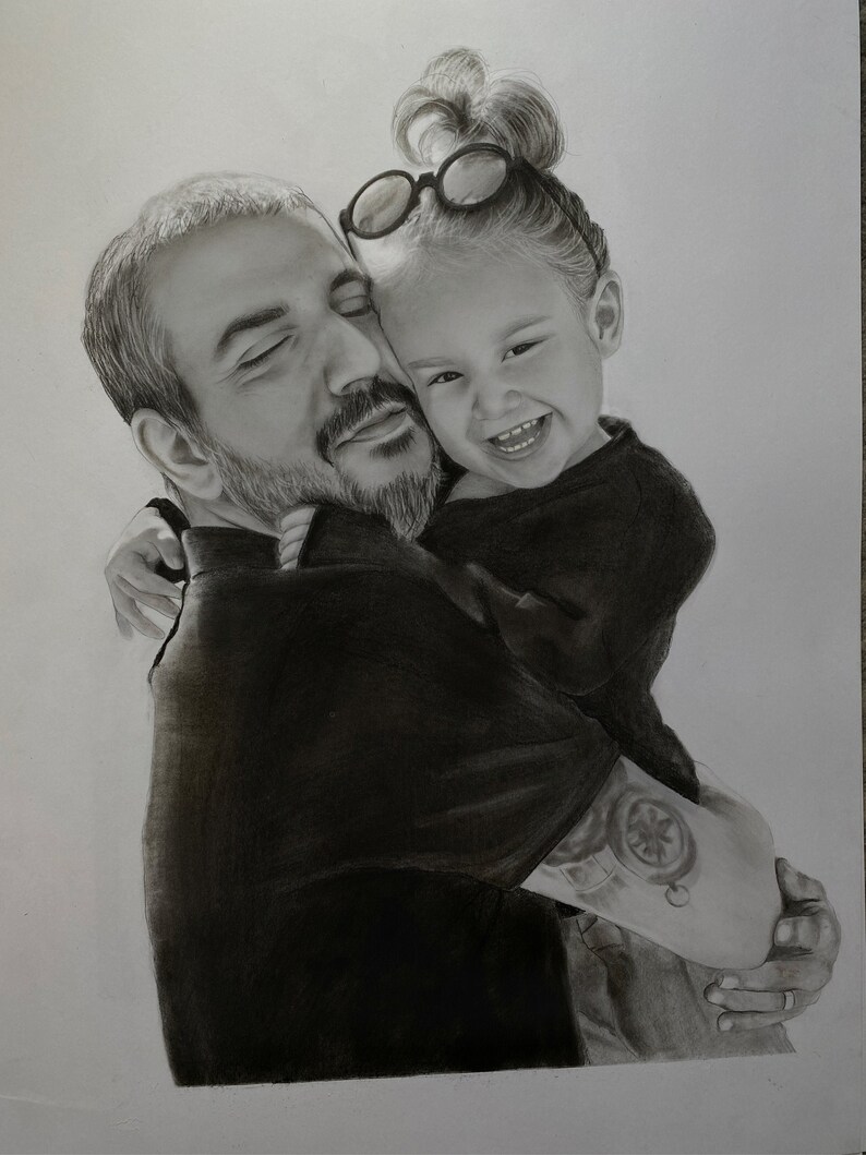 May include: A pencil sketch of a man embracing a young child. The man has a beard and a tattoo on his arm. The child is smiling and wearing glasses on top of their head. The artwork is in black and white.