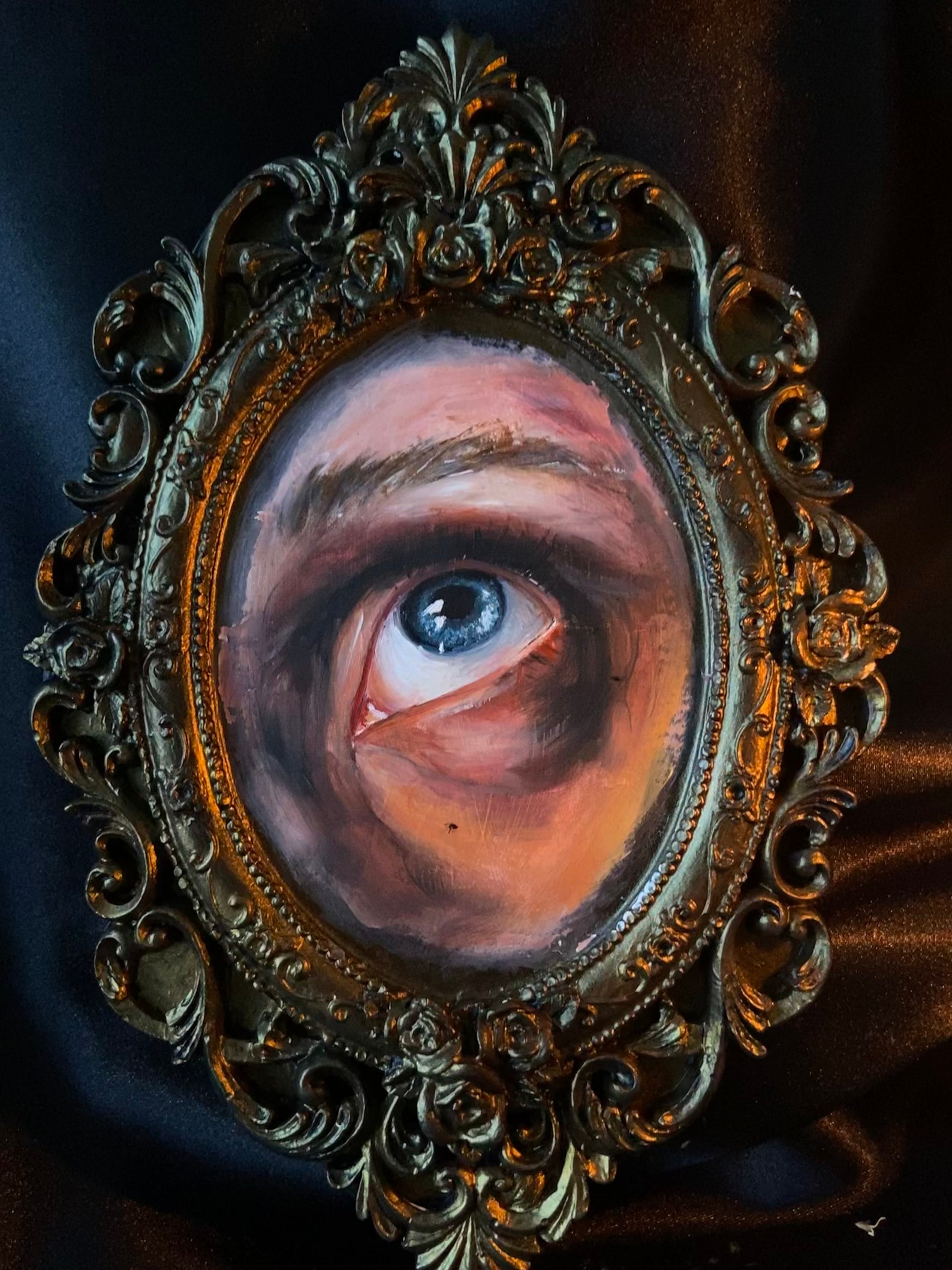 Close up oil painting replica of the eye from the classic painting The Lovers.