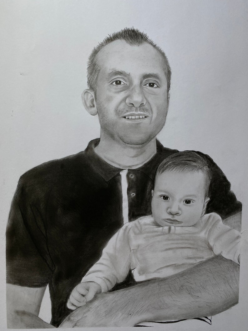 May include: A pencil drawing of a man holding a baby. The man is wearing a dark polo shirt with a white collar. The baby is wearing a long-sleeved shirt. The drawing is in black and white.