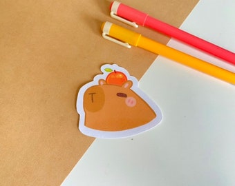 Capybara avec une orange sur la tête autocollant | Autocollants découpés à l'emporte-pièce | revue | autocollant pour ordinateur portable | planificateur | uniques | mignon | animal