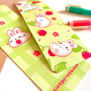 Springtime Bunnies and Raspberries green laminated double sided bookmark image 2