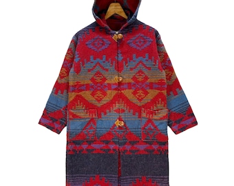 May include: A long, hooded coat with a vibrant geometric pattern in red, blue, and gold. The coat features wooden toggle closures and two front pockets. The design is reminiscent of Southwestern textiles.