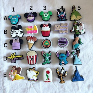 May include: A set of 20 colourful Disney character shoe charms. The charms feature characters such as Mickey Mouse, Minnie Mouse, Stitch, and Cinderella. The charms are made of a soft, rubbery material and are ideal for adding a touch of Disney magic to your shoes.