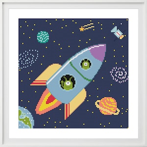 May include: A blue and purple rocket ship with two green aliens in the windows, flying through space with a yellow comet, a satellite, and planets in the background.