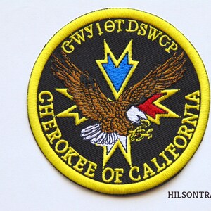 May include: A yellow and black embroidered patch with the text "Cherokee of California G.W.Y.I.O.T.D.S.W.G.P."