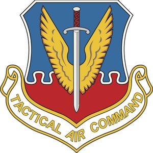May include: A blue, red, and gold shield with a sword and wings. The shield has the text "Tactical Air Command" around the bottom.