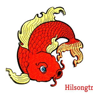 May include: Red and yellow embroidered iron-on patch of a stylized koi fish with a swirling tail.