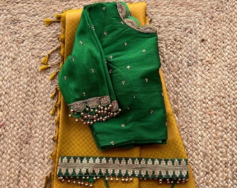 Groene zijden blouse met handgeborduurde details