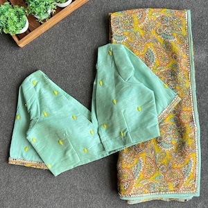 Fenugreek floral organza saree with hand worked blouse