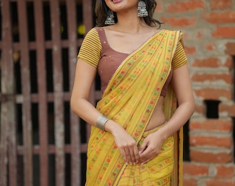 Yellow chiffon floral saree with hand work blouse