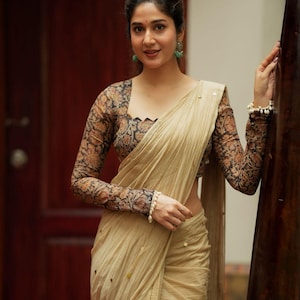 Cream malai chanderi saree with Ajrak print blouse