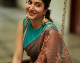 Brown kalamkari kota saree with blue hand work blouse