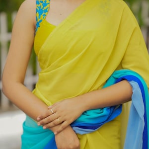 Multi georgette saree with yellow hand made blouse
