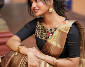 Golden tissue saree with black hand work blouse