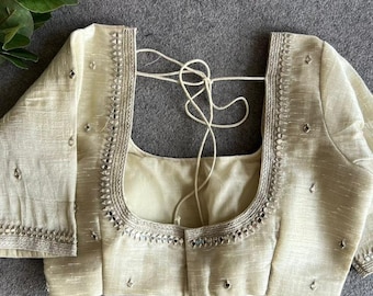 Blusa bordada com espelhos de tecido prateado