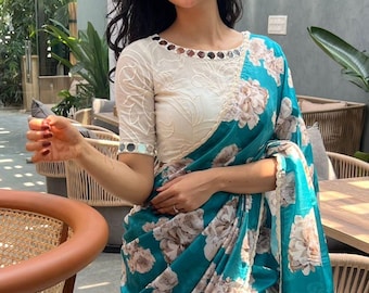 Blue floral soft silk saree with cotton mirror work blouse