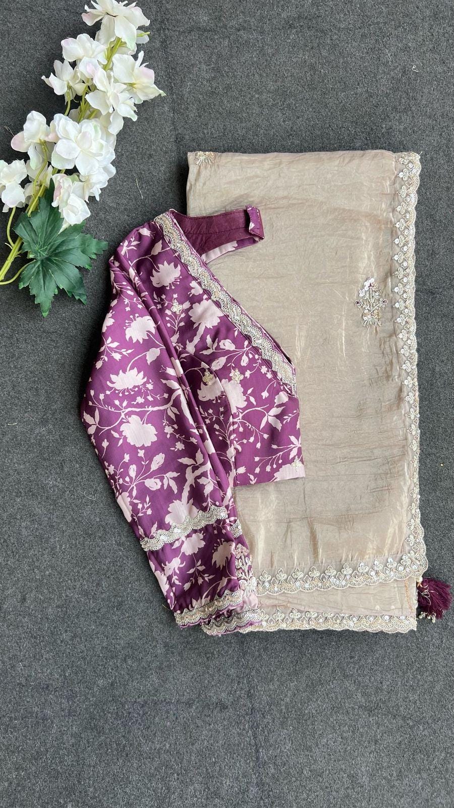 Cream soft tissue saree with wine floral embroidery blouse