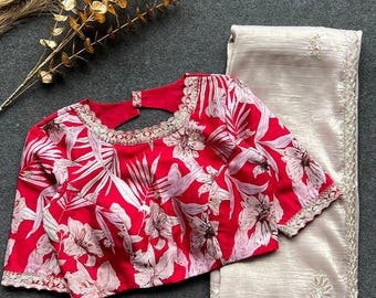 Cream soft glass tissue saree with red floral embroidery blouse