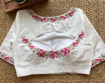 Witte blouse met gedetailleerd handwerk en bloemenmotief