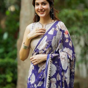 Purple chiffon floral saree with hand work blouse