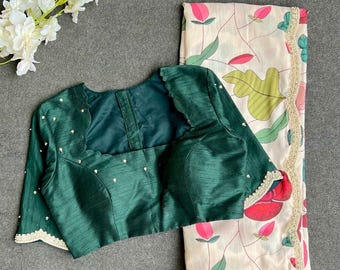 Half white floral kossa saree with green hand worked blouse