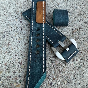 Blue leather watch strap.