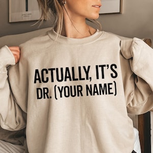 Personalized It's Dr Actually Sweatshirt, PHD Gift, New Doctor Sweater, Medical Student Gift PHD Graduate, New Dr Gift Phd Graduation Gifts