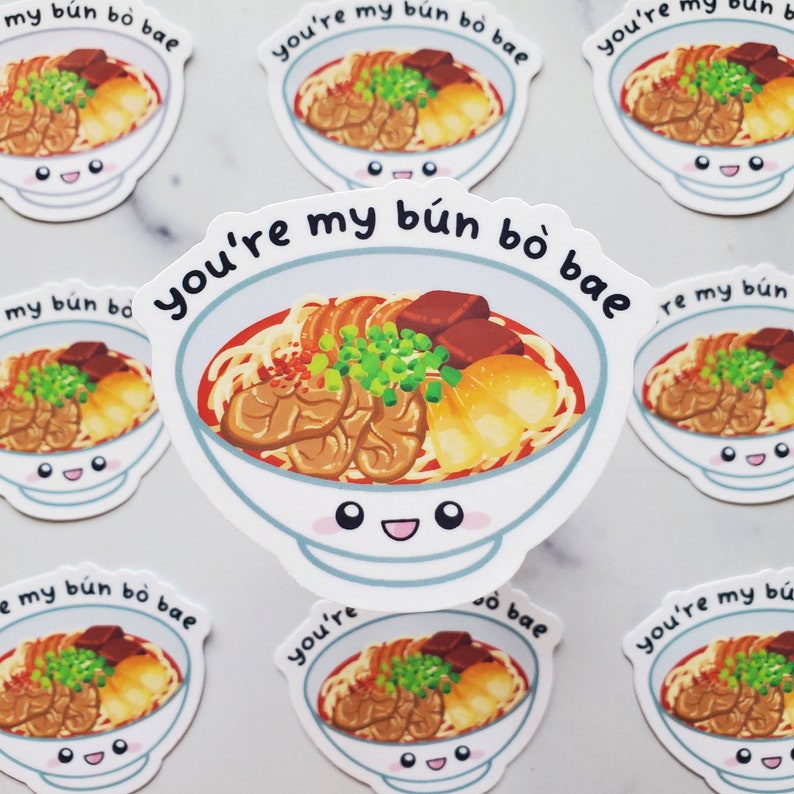 May include: A set of eight stickers featuring a cartoon bowl of bun bo hue, a Vietnamese noodle soup. The bowl has a smiling face and the text "You're my b&uacute;n b&ograve; bae" is written around the bowl.