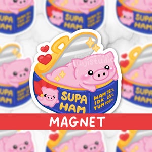 May include: A pink pig cartoon inside a blue and yellow can labeled "SUPA HAM". The magnet has a red banner at the bottom that says "MAGNET". The can has a pig illustration and the text "HAM 75% IDK 25% YUM 100%."