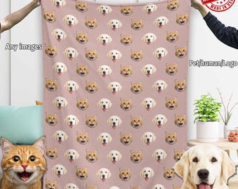 May include: A pink fleece blanket with a repeating pattern of dog and cat faces. The blanket is made in the USA.