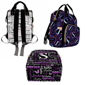 K&ouml;nnte beinhalten: Drei verschiedene Stile von schwarzen und wei&szlig;en gemusterten Wickeltaschen mit dem Namen "Sophia", der in lila und rosa Schrift wiederholt wird. Die Taschen haben goldene Rei&szlig;verschl&uuml;sse und schwarze Tr&auml;ger. Eine Tasche hat ein Schmetterlingsdesign.